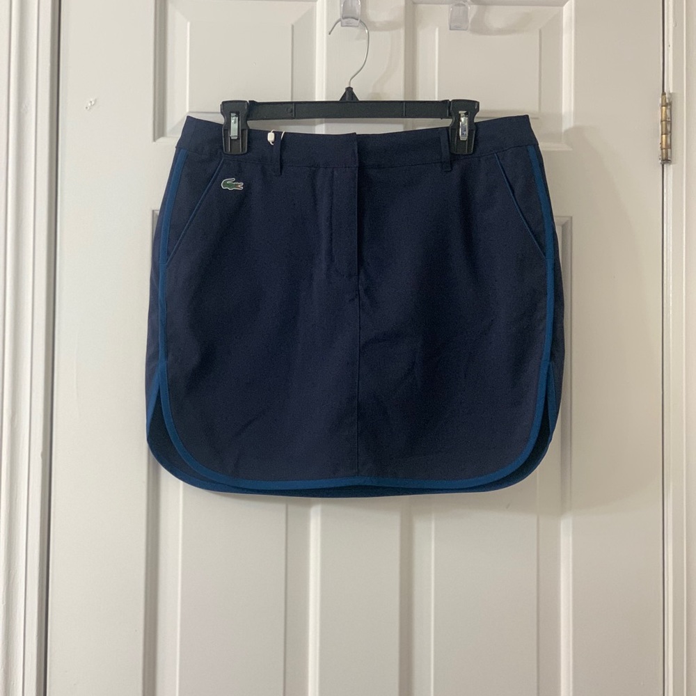 Lacoste Sport Skort. NWT, extra button still attached. Perfect condition.